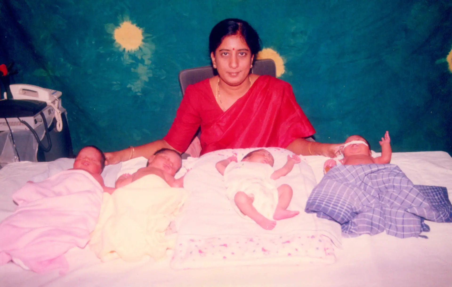 Photo shows Dr. Rama devi Kolli with four newborns, all of whom were delivered within a week, in 2001 at Karthika Dattas IVF, Vijayawada.