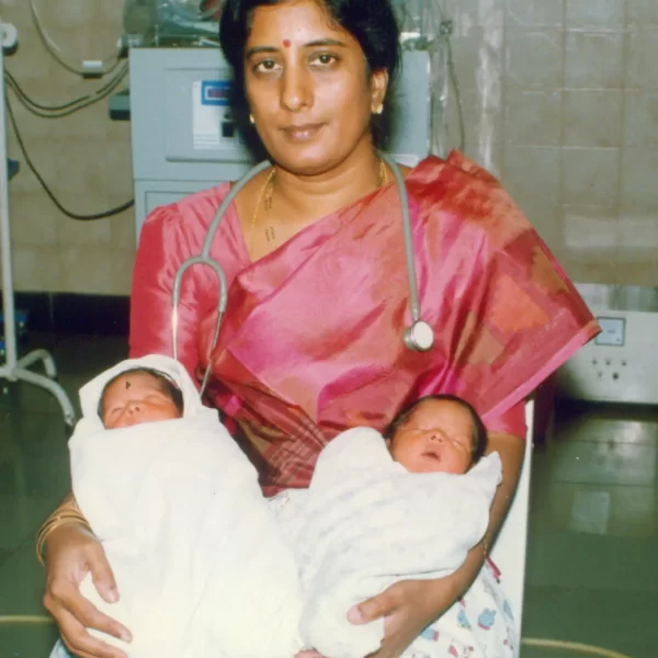Photo shows Dr. Rama Devi Kolli holding twin babies, they being the first ICSI babies of coastal Andhra Pradesh, born at our clinic in 2001.